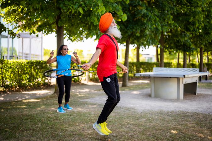 Mature Sikh people working out in park