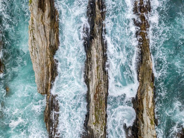 Stone ridges on high seas in stormy day