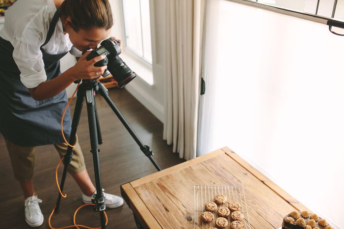 Female taking pictures of cookies for blog