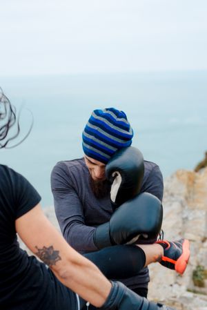 Boxers exercising on cliff