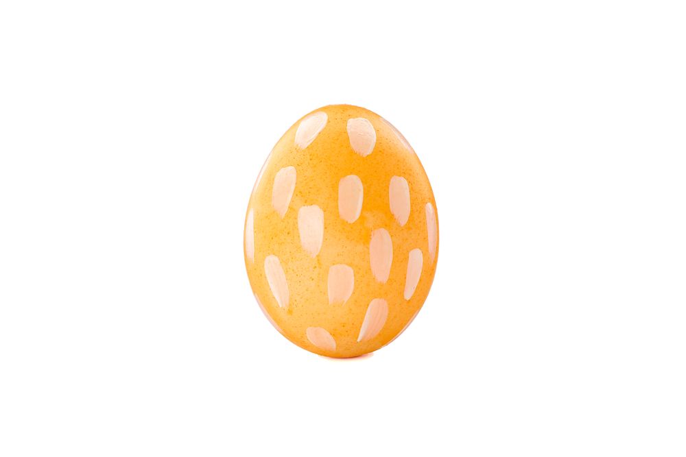 Decorative Easter egg isolated on light background. Festive tradition