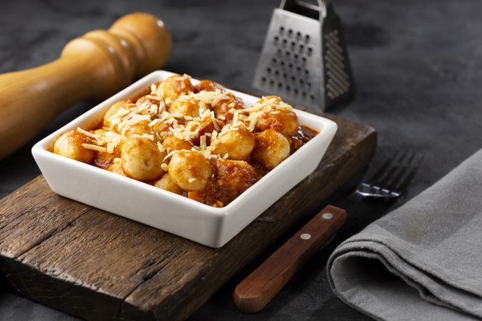 Gnocchi with tomato sauce and grated Parmesan cheese.
