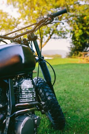 Custom motorcycle parked on the grass