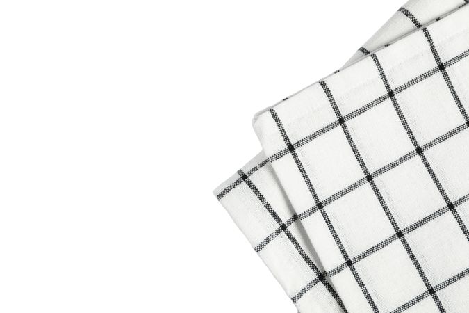 Folded fabric napkin isolated on plain background