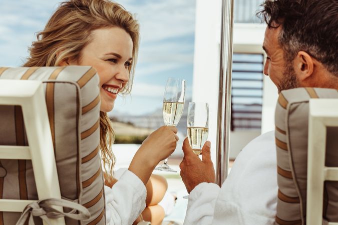 Smiling couple relaxing in a luxury villa