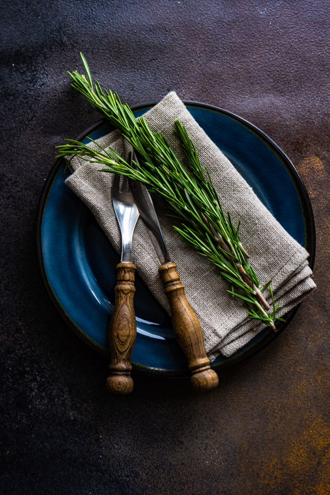 Cutlery set with fresh rosemary