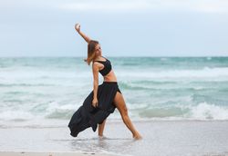 woman dancing near sea