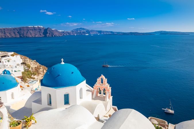 Greek Orthodox Church with classic blue dome overlooking the Aegean Sea