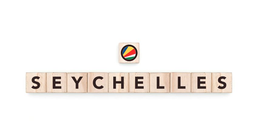 Wooden blocks bearing the name and flag of Seychelles. Seychellois, Indian and African Culture, national identity, travel, and geography in a copy space design.