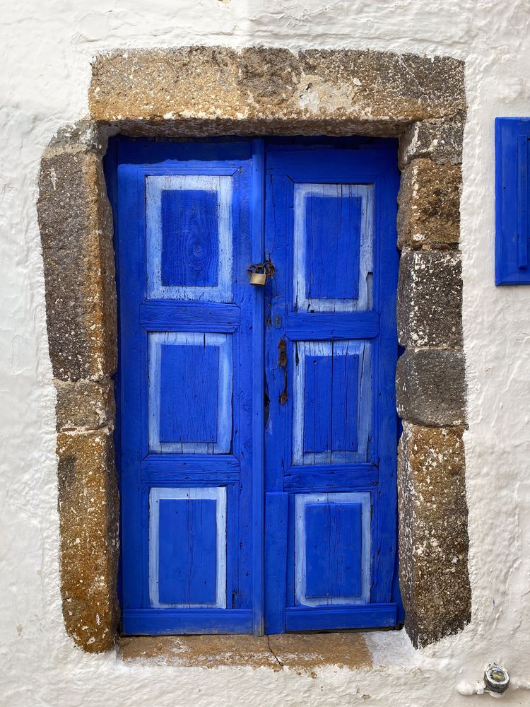 Patmian blue door with padlock