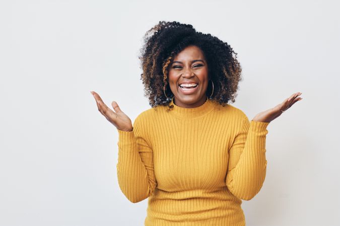 Happy joyful woman with her hands up