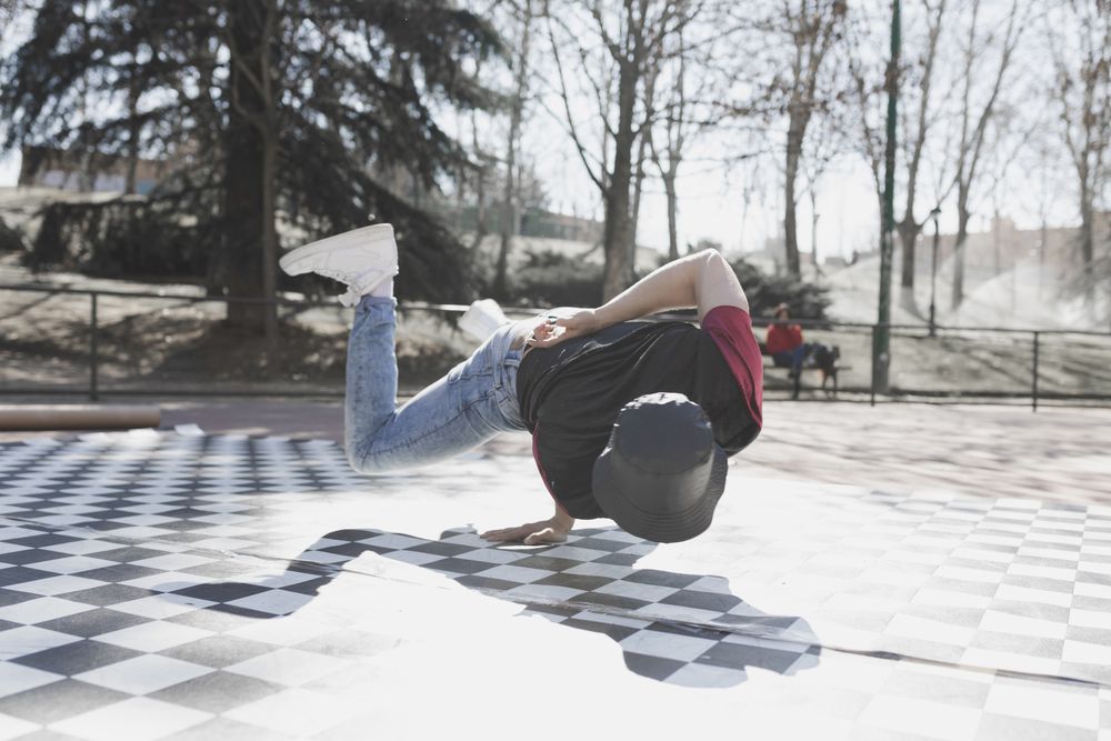 Man dancing break dance in park