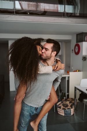 Multiracial couple having fun at home