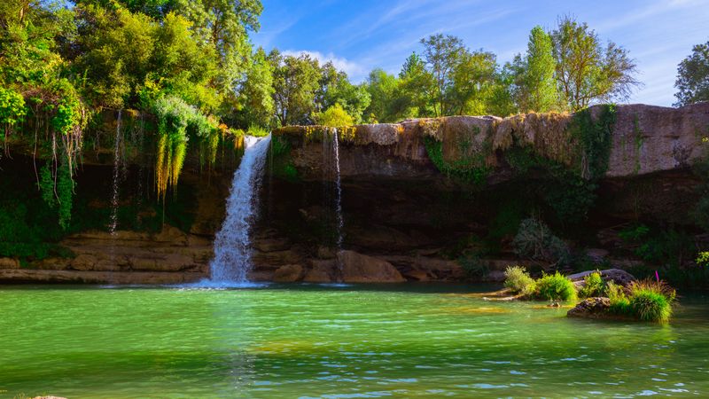 View of beautiful waterfall and lake