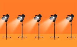 Studio lamps over orange background