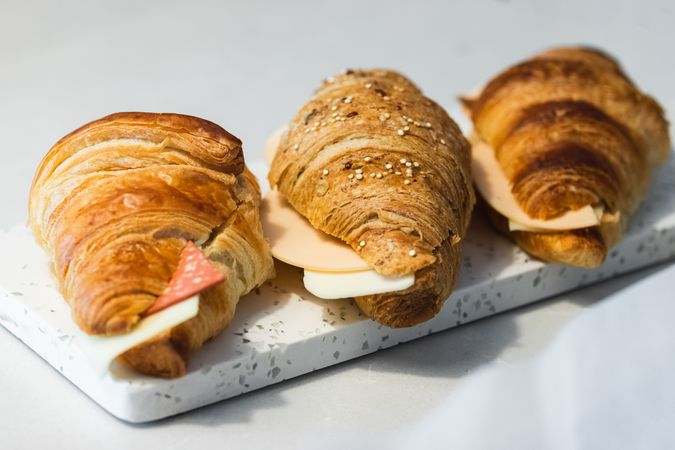 Tasty croissants with cheese and ham
