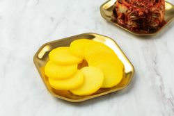 Takuan radish side on brass plate