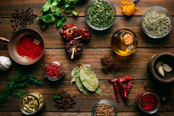 Spices and oil on table