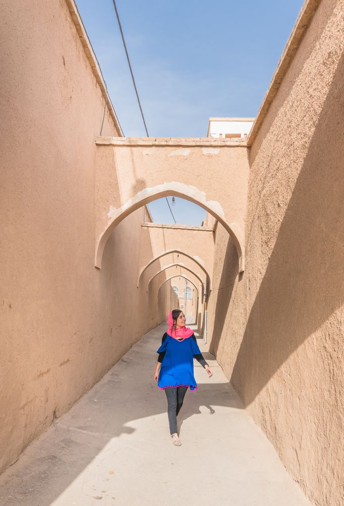 Woman standing on terrace of traditional oriental mosque