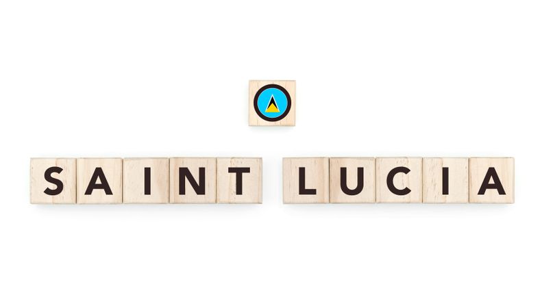 Wooden blocks bearing the name and flag of Saint Lucia. Saint Lucian and Caribbean Culture, national identity, travel, and geography in a copy space design.