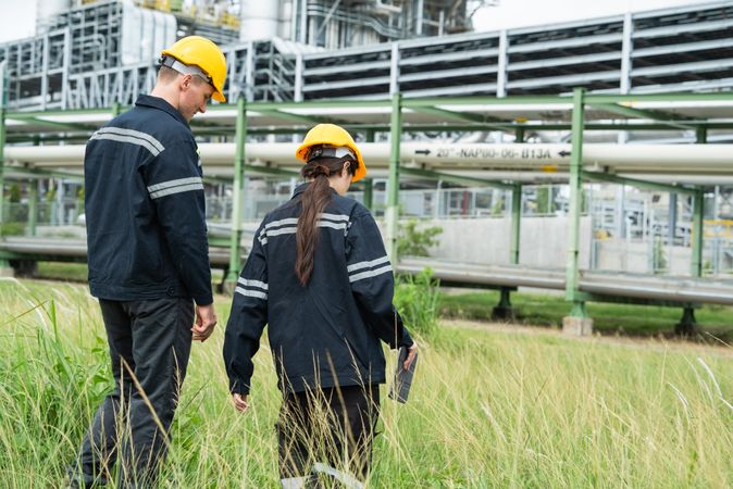 Engineer worker checking project at petrochemical factory or refinery oil plant industrial.