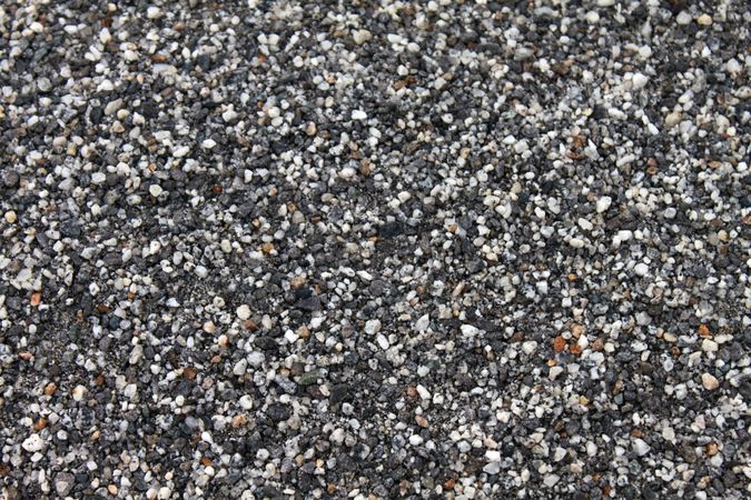 Close up top view of light and dark grey pebbles