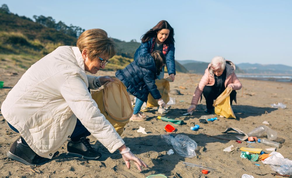 Female volunteers cleaning the beach