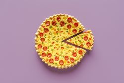 Quiche top view, minimalist on a purple background