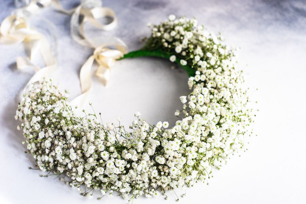 Headdress of gypsophila paniculata flowers on marble table