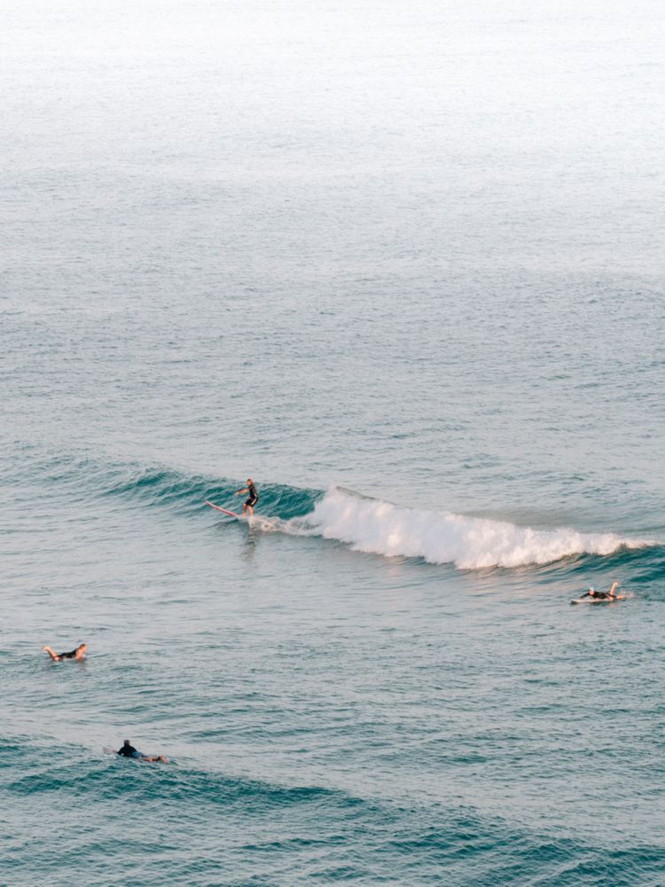 People surfing on sea waves