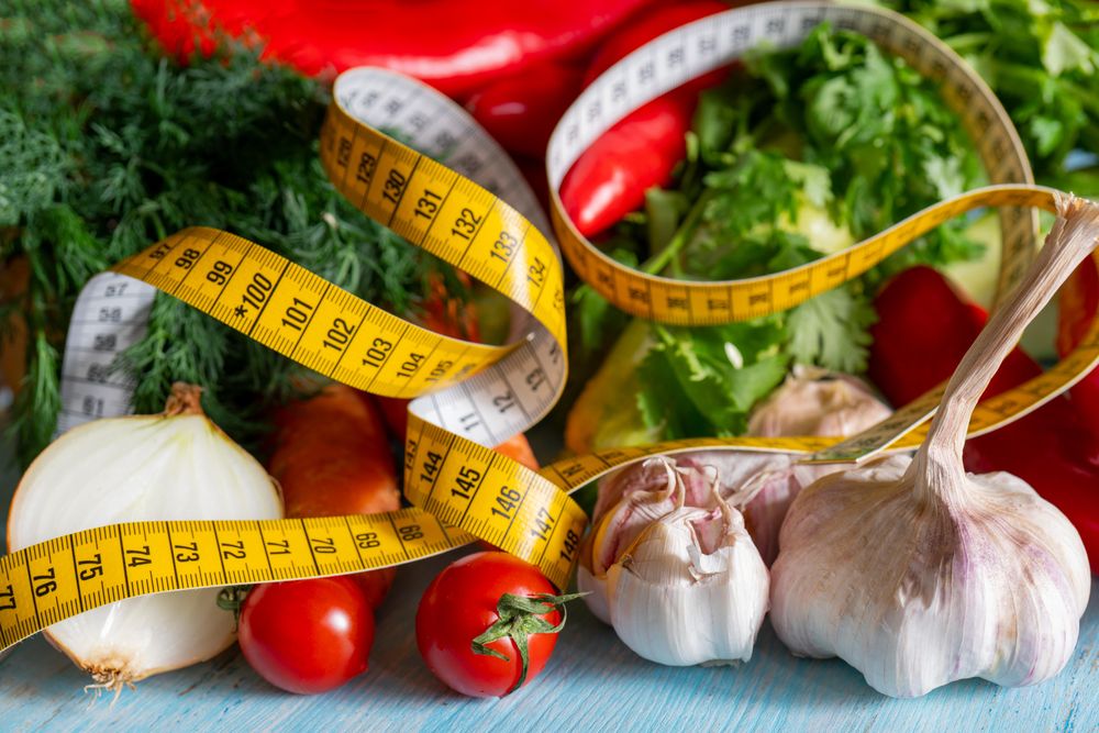 Vegetables and body measuring tape