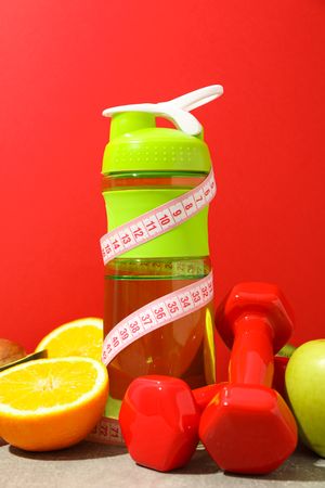 Loss weight accessories on grey table against red background