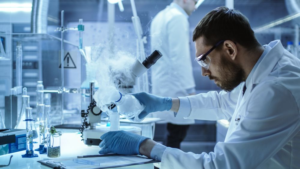 In a Chemical Research Laboratory Scientist Mixes Smoking Compounds in Beakers.
