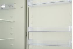 Empty shelves of empty modern fridge