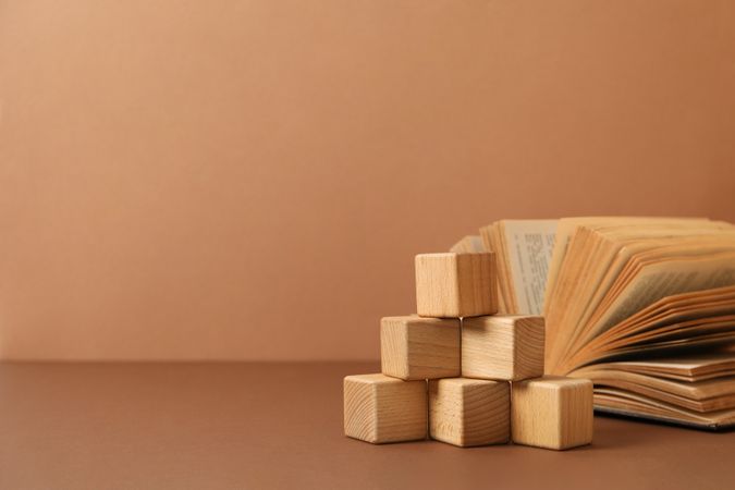 A children's book with toys on a beige background.