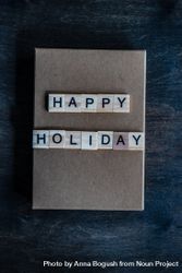 Happy holiday card on navy table bD7Dy4