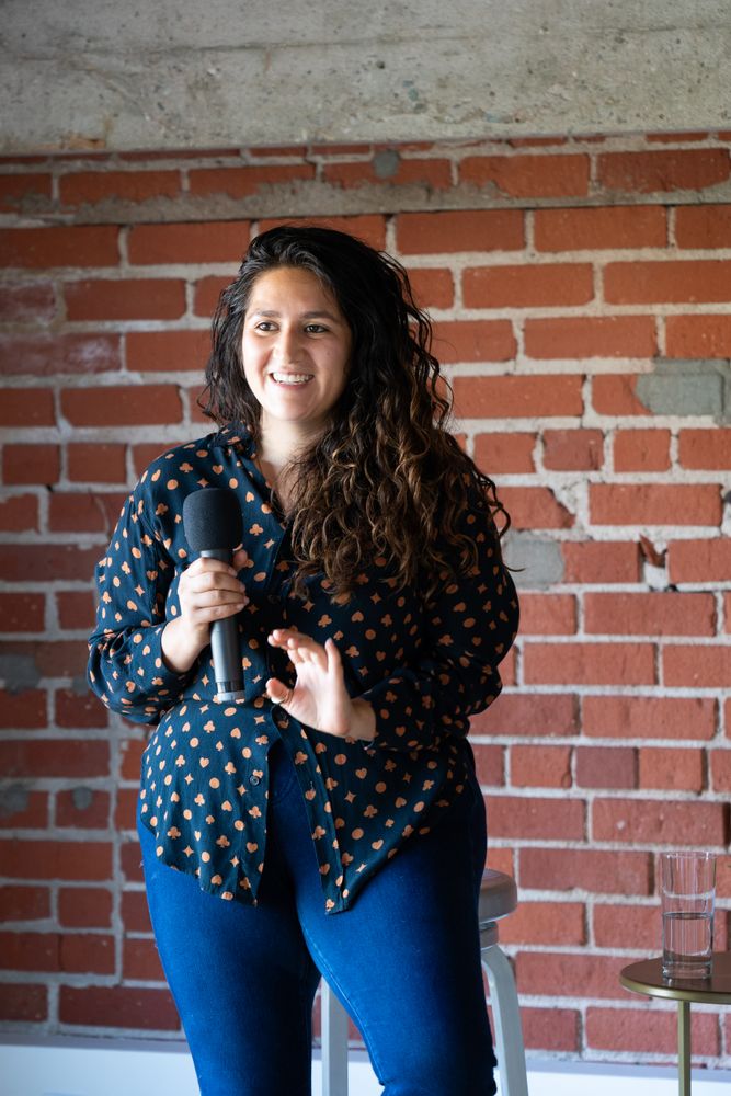 Woman smiling while giving a talk