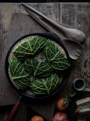 Cabbage rolls stuffed with rice in frying pan