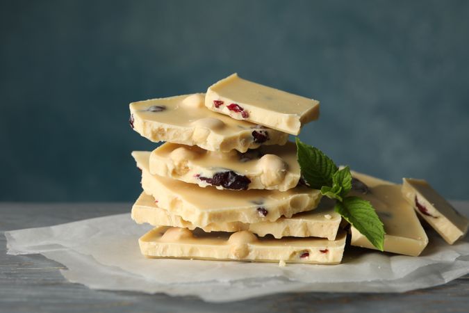 Pile of chocolate and mint on gray wooden table