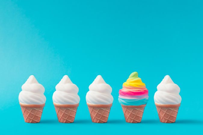 Row of colorful ice cream pattern on bright blue background