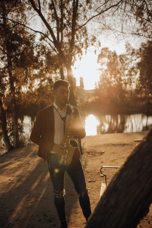 Man playing on saxophone in park
