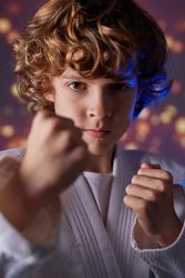 Kid with clenched fists during judo training