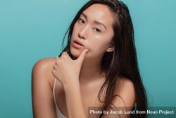 Beautiful young Korean woman with glowing skin bD23V5
