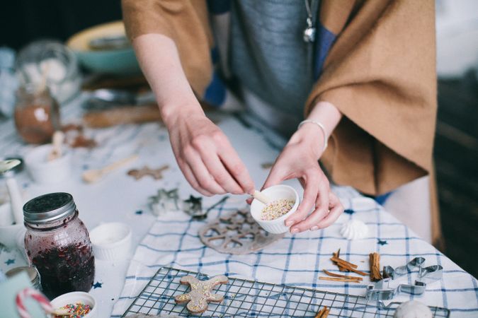 Cropped image of woman preparing ginger cookies for Christmas