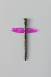 Nail on light background crossed with pink streak