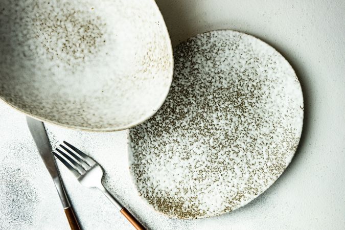 Minimalistic table setting with elegant grey ceramic plates with space for text