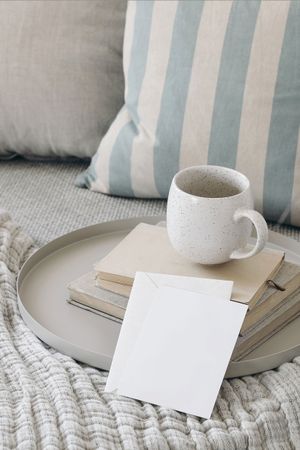 Cup of coffee, old books and tray.