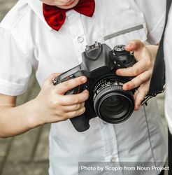 Boy holding a camera 0J62p0