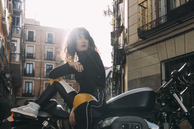 Young woman in custom motorbike