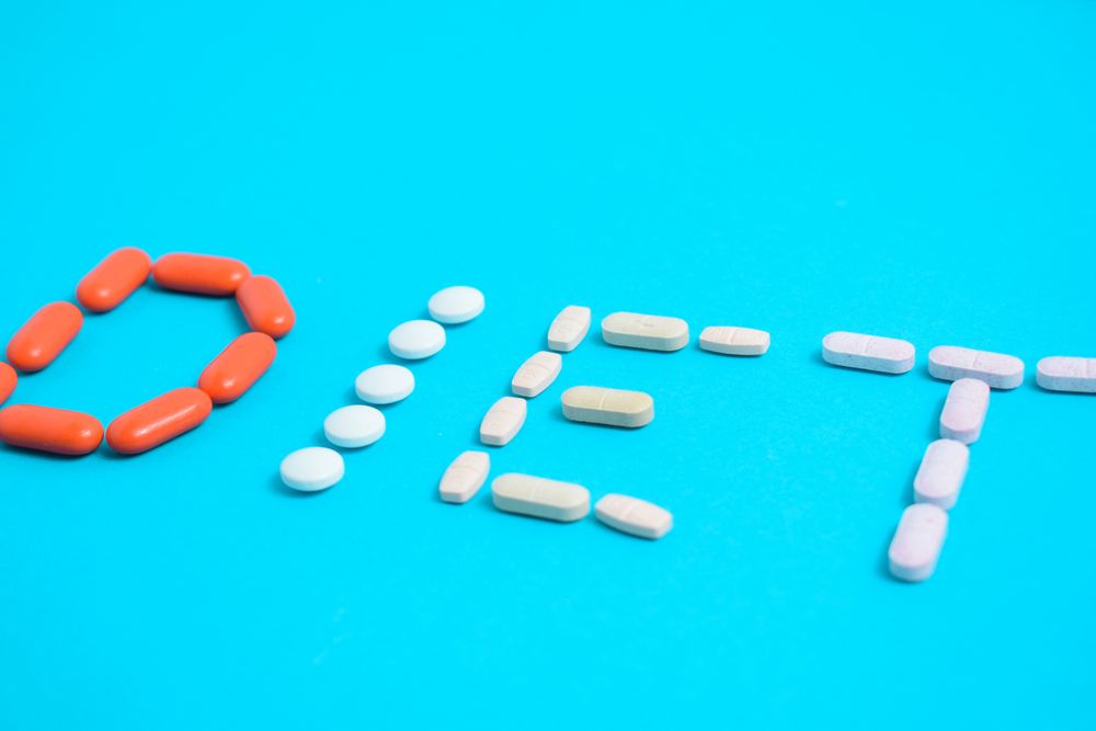 Various pills making the word "DIET"